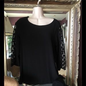 Black shirt with sheer polka dot sleeves